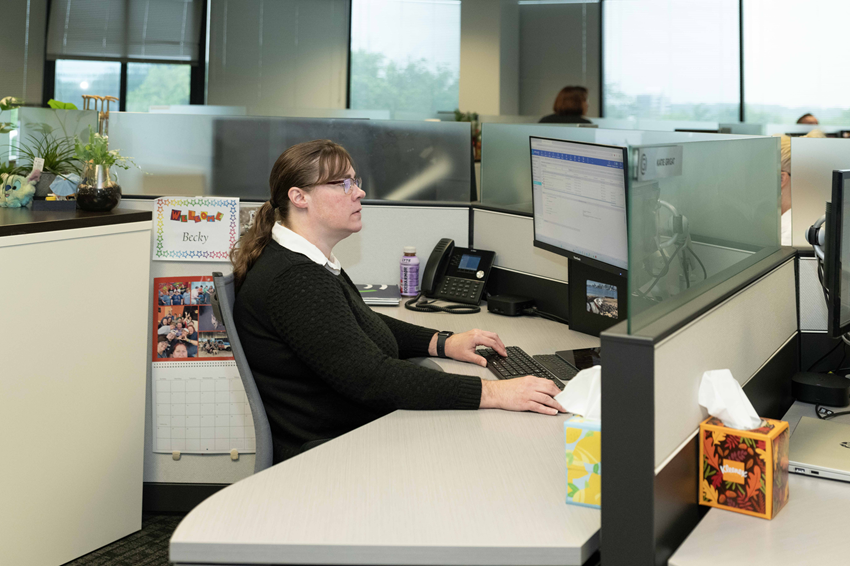 CGO Insurance Expert working on a computer