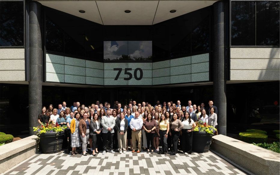 Company Photo in front of Headquarters