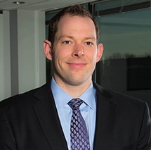 Headshot of Justin Mangan